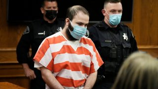 FILE - Ahmad Al Aliwi Alissa, accused of killing 10 people at a Colorado supermarket in March 2021, is led into a courtroom for a hearing, Sept. 7, 2021, in Boulder, Colo.