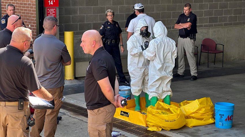 A hazmat crew from the National Guard's Civilian Support Team investigates after a suspicious package was delivered to election officials at the Missouri Secretary of State's Jefferson City, Mo., office on Tuesday Sept. 17, 2024.