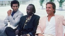 MIAMI-VICE-- "Junk Love" Episode 6 – Air date 11/08/1985 – Pictured: (l to r) Philip Michael Thomas as Detective Ricardo “Rico” Tubbs, Miles Davis as Ivory Jones and Don Johnson as Detective James “Sonny” Crockett (Photo by NBCU Photo Bank/NBCUniversal via Getty Images via Getty Images)