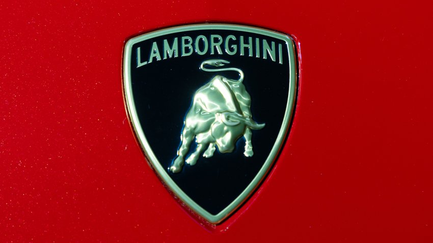 The Lamborghini SpA logo on the company’s Urus sports utility vehicle (SUV) displayed at the company’s event to mark the automaker’s 60th anniversary in Seoul, South Korea, on Thursday, Sept. 14, 2023. Lamborghini is capitalizing on the demand for indulgence in South Korea, with sales of its iconic sport cars poised to surpass last year’s record. Photographer: SeongJoon Cho/Bloomberg via Getty Images