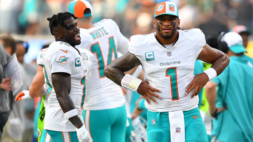 INGLEWOOD, CA – SEPTEMBER 10: Miami Dolphins wide receiver Tyreek Hill (10) and Miami Dolphins quarterback Tua Tagovailoa (1) look on during the NFL regular season game between the Miami Dolphins and the Los Angeles Chargers on September 10, 2023, at SoFi Stadium in Inglewood, CA. (Photo by Brian Rothmuller/Icon Sportswire via Getty Images)