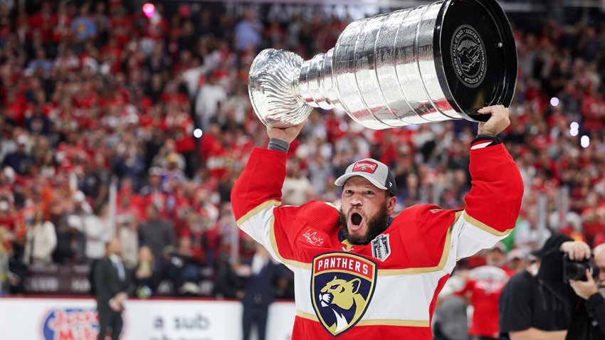 SUNRISE, FLORIDA – JUNE 24: Kyle Okposo #8 of the Florida Panthers hoists the Stanley Cup after Florida’s 2-1 victory against the Edmonton Oilers in Game Seven of the 2024 Stanley Cup Final at Amerant Bank Arena on June 24, 2024 in Sunrise, Florida.  (Photo by Carmen Mandato/Getty Images)