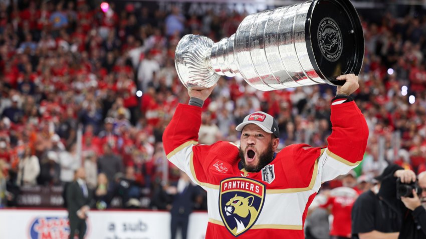SUNRISE, FLORIDA – JUNE 24: Kyle Okposo #8 of the Florida Panthers hoists the Stanley Cup after Florida’s 2-1 victory against the Edmonton Oilers in Game Seven of the 2024 Stanley Cup Final at Amerant Bank Arena on June 24, 2024 in Sunrise, Florida. (Photo by Carmen Mandato/Getty Images)