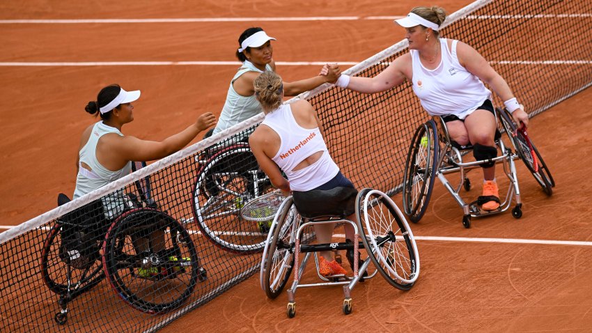 PARIS, FRANCE – SEPTEMBER 03: Diede de Groot of the Netherlands and Aniek van Koot of the Netherlands react with Xiaohui Li of China and Zhenzhen Zhu of China after the Women’s Wheelchair Tennis Doubles Semi Final match on day six of the Paris 2024 Summer Paralympic Games at Roland Garros on September 03, 2024 in Paris, France. (Photo by Daniel Kopatsch/Getty Images)