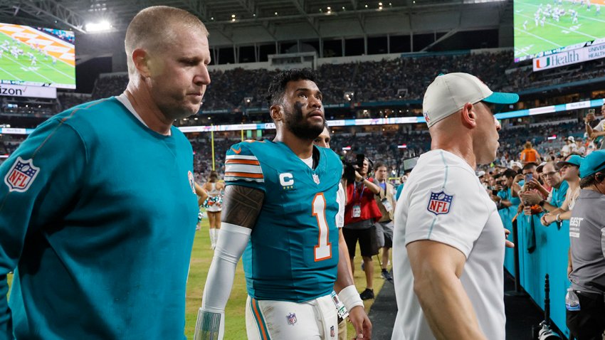 Miami Dolphins quarterback Tua Tagovailoa (1) leaves the field after suffering a concussion against on Thursday, Sept. 12, 2024, at the Hard Rock Stadium in Miami Gardens, Florida. (Joe Cavaretta/South Florida Sun Sentinel/Tribune News Service via Getty Images)