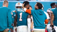 MIAMI GARDENS, FLORIDA – SEPTEMBER 12: Head coach Mike McDaniel of the Miami Dolphins embraces Tua Tagovailoa #1 after leaving the game with an injury during the third quarter against the Buffalo Bills at Hard Rock Stadium on September 12, 2024 in Miami Gardens, Florida. (Photo by Megan Briggs/Getty Images)