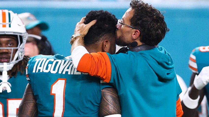 MIAMI GARDENS, FLORIDA – SEPTEMBER 12: (EDITORS NOTE: Retransmission with alternate crop.) Head coach Mike McDaniel of the Miami Dolphins embraces Tua Tagovailoa #1 after leaving the game with an injury during the third quarter against the Buffalo Bills at Hard Rock Stadium on September 12, 2024 in Miami Gardens, Florida. (Photo by Megan Briggs/Getty Images)