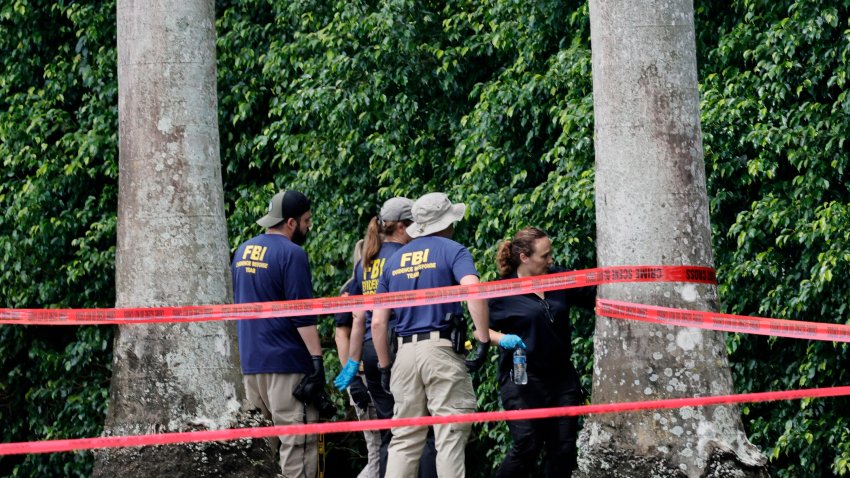 FBI investigators are shown at Trump International Golf Club in West Palm Beach, Florida, on Monday, Sept. 16, 2024. Ryan Wesley Routh, 58, was arrested Sunday afternoon after Secret Service agents saw a firearm sticking out of bushes at the golf club where former President Donald Trump was playing. (Amy Beth Bennett/South Florida Sun Sentinel/Tribune News Service via Getty Images)