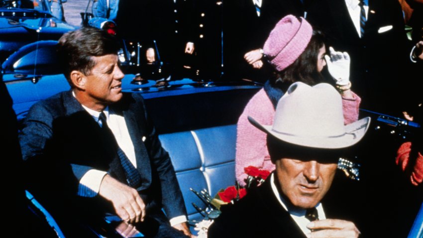 President John F Kennedy (left), First Lady Jacqueline Kennedy (in pink), and Texas Governor John Connally