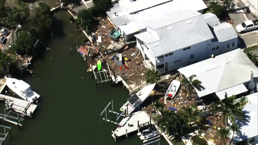 Aerial image of damaged boats and homes