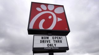 A sign hangs outside of a Chick-fil-A restaurant on May 06, 2021 in Chicago, Illinois. 