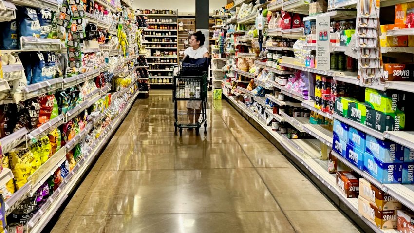 A customer shops at a Whole Foods grocery store in Edgewater, N.J. on Sept. 11th, 2024. 