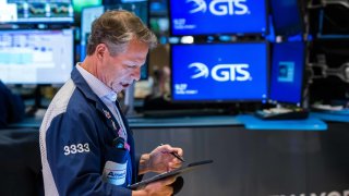 A trader works on the floor of the New York Stock Exchange. 