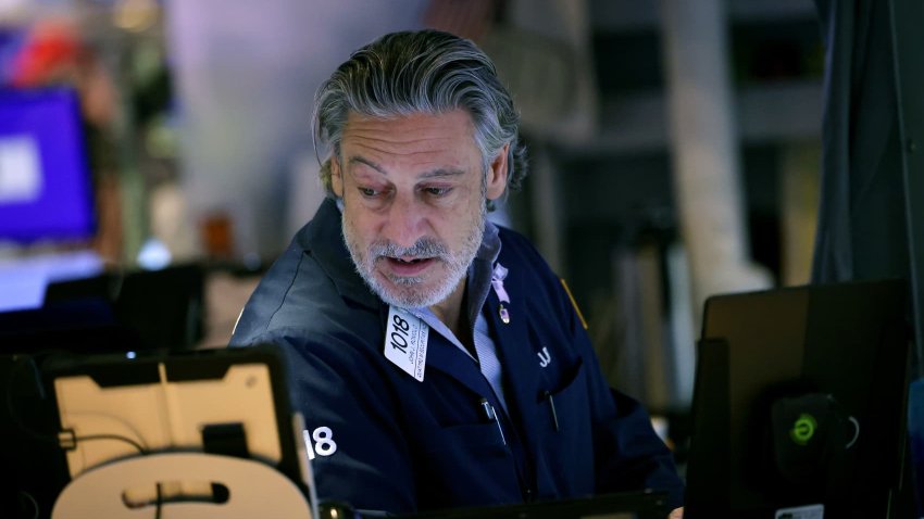 Traders work on the floor of the New York Stock Exchange during afternoon trading on October 03, 2024 in New York City.