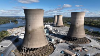 In this aerial view, the shuttered Three Mile Island nuclear power plant stands in the middle of the Susquehanna River near Middletown, Pennsylvania, on Oct. 10, 2024.