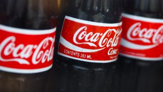 Vintage Coca-Cola bottles are seen in a shop window in Manhattan, New York City, on July 15, 2024.