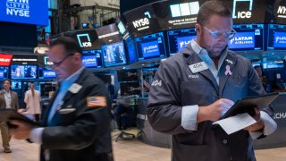 Traders work on the floor of the New York Stock Exchange on Oct. 22, 2024.