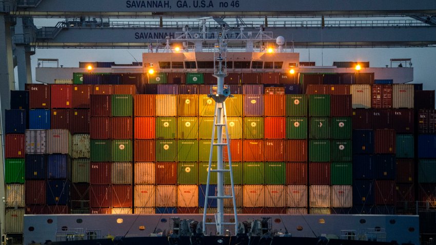 FILE – Ship to shore cranes work the container ship CMA CGM Laperouse at the Georgia Ports Authority’s Port of Savannah, Sept. 29, 2021, in Savannah, Ga.