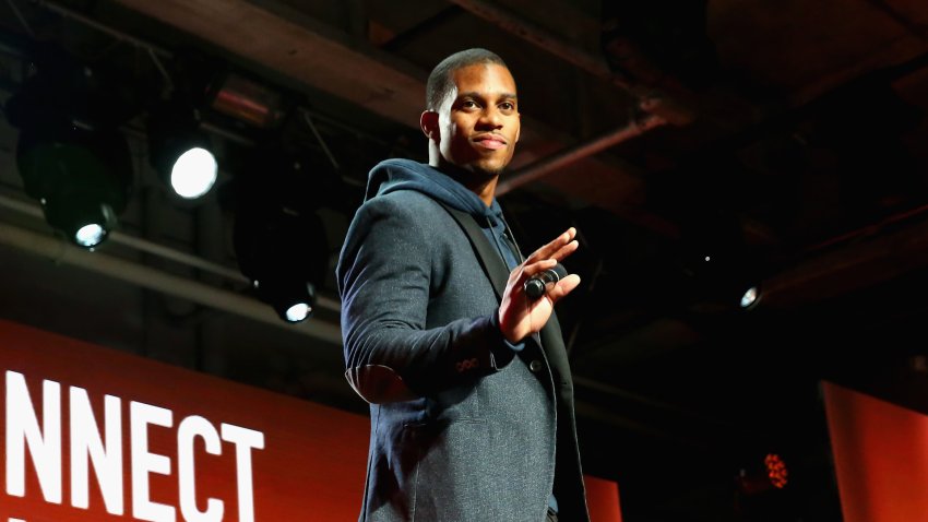 Victor Cruz speaking at an event.