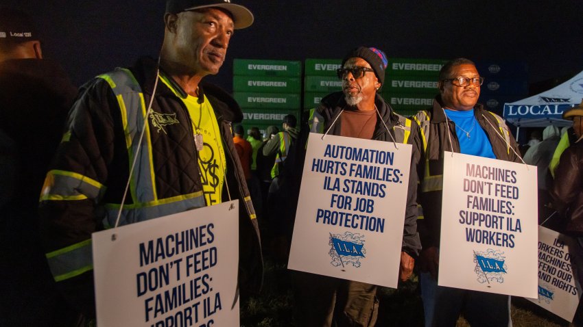 Workers picket outside of the APM container terminal at the Port of Newark in Newark, New Jersey, US, on Monday, Sept. 30, 2024. Dockworkers have walked out of every major port on the US East and Gulf coasts, marking the beginning of a strike that could ripple through the world’s largest economy and cause political turmoil just weeks before the presidential election. Photographer: Michael Nagle/Bloomberg via Getty Images