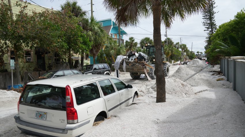 A Florida Army National Guard loader moves debris from the Pass-A-Grille section of St. Petersburg ahead of Hurricane Milton’s expected landfall in the middle of this week on October 7, 2024 in Florida. Florida’s governor has declared a state of emergency on Saturday as forecasters warned that Hurricane Milton is expected to make landfall later this week. (Photo by Bryan R. SMITH / AFP) (Photo by BRYAN R. SMITH/AFP via Getty Images)