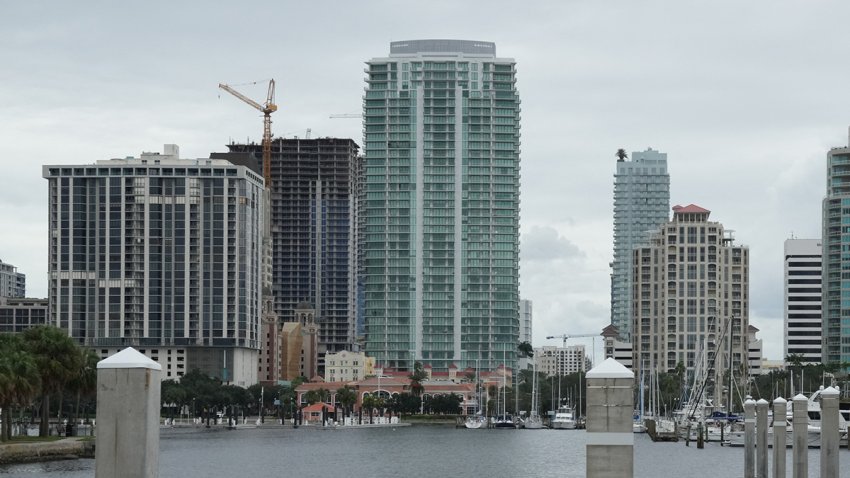 Highrise buildings are seen past a marina in St. Petersburg, Florida ahead of Hurricane Milton’s expected landfall in the middle of this week on October 8, 2024. Storm-battered Florida girded Tuesday for a direct hit from Hurricane Milton, a monster weather system threatening catastrophic damage and forcing President Joe Biden to postpone a major overseas trip. (Photo by Bryan R. SMITH / AFP) (Photo by BRYAN R. SMITH/AFP via Getty Images)