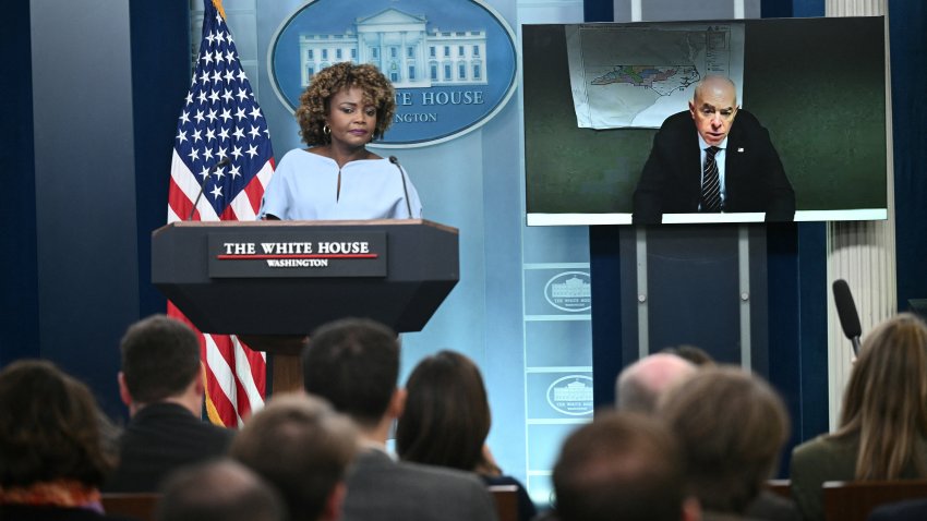 White House Press Secretary Karine Jean-Pierre listens to US Homeland Security Secretary Alejandro Mayorkas speak via video link during the daily briefing in the Brady Briefing Room of the White House in Washington, DC, on October 10, 2024.