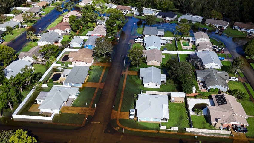 An aerial view shows a flooded neighborhood