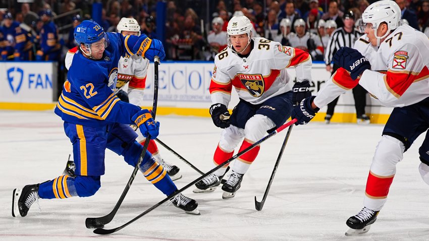 BUFFALO, NEW YORK – OCTOBER 12: Niko Mikkola (R) #77 of the Florida Panthers blocks the shot of Jack Quinn #22 of the Buffalo Sabres during the first period of an NHL game against the Florida Panthers at KeyBank Center on October 12, 2024 in Buffalo, New York. (Photo by Ben Ludeman/NHLI via Getty Images)