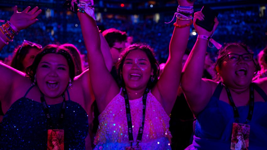 Fans of US singer Taylor Swift cheer during “The Eras Tour” at the Hard Rock stadium in Miami Gardens, Florida, October 18, 2024. (Photo by CHANDAN KHANNA / AFP) (Photo by CHANDAN KHANNA/AFP via Getty Images)