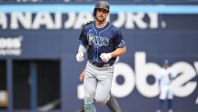 Jul 25, 2024; Toronto, Ontario, CAN; Tampa Bay Rays designated hitter Brandon Lowe (8) rounds the bases after hitting a solo home run against the Toronto Blue Jays in the first inning at Rogers Centre. Mandatory Credit: Dan Hamilton-USA TODAY Sports