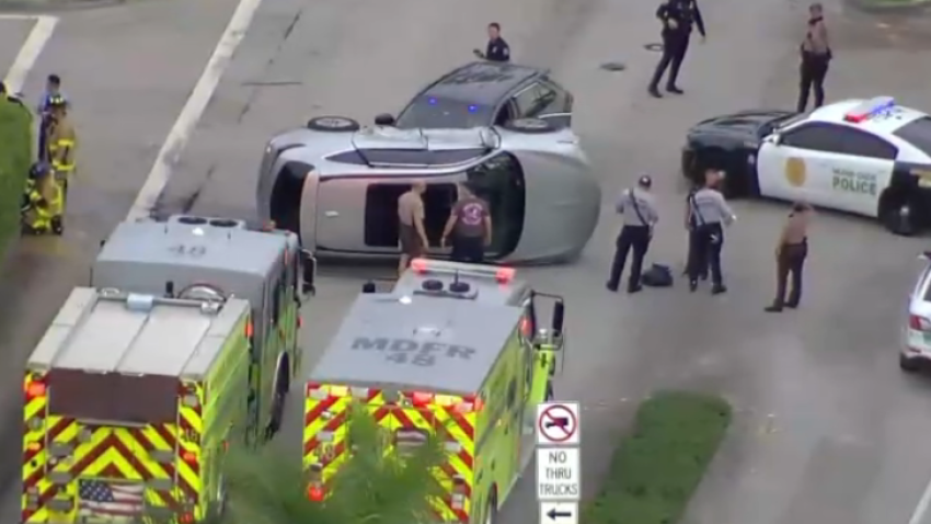 An SUV rolled onto its side after it struck an unmarked Miami-Dade police vehicle in Doral on Wednesday, according to police.