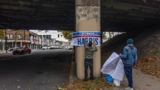 Supporters of Kamala Harris put up posters in Latino neighborhoods in Philadelphia on Oct. 14