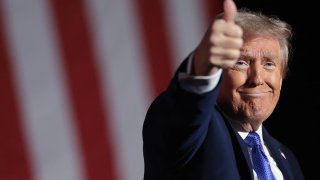 Republican presidential nominee, former U.S. President Donald Trump, reacts to the crowd as he concludes a campaign rally on October 19, 2024, in Latrobe, Pennsylvania. 