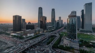 BEIJING, CHINA – SEPTEMBER 04: Buildings and vehicles are seen in the central business district during the rush hour on September 4, 2020 in Beijing, China.