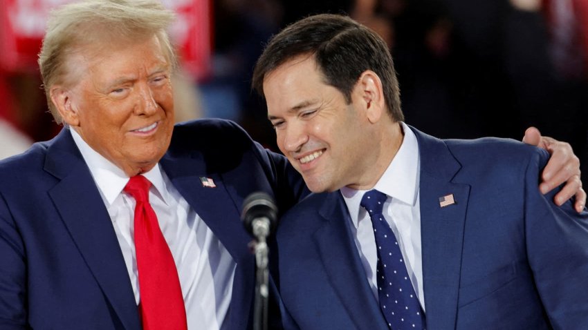 Republican presidential nominee and former U.S. President Donald Trump and Senator Marco Rubio (R-FL) react during a campaign event at Dorton Arena, in Raleigh, North Carolina, U.S. November 4, 2024. 