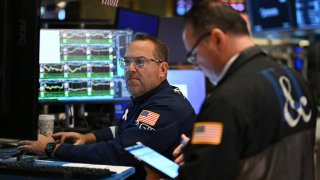 Traders work on the floor of the New York Stock Exchange at the opening bell on November 13, 2024, in New York City. 