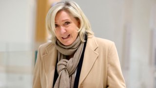 Member of French far-right party Rassemblement National (RN) Marine Le Pen walks at the Paris courthouse amid her trial on suspicion of embezzlement of European public funds, in Paris, on November 27, 2024. 