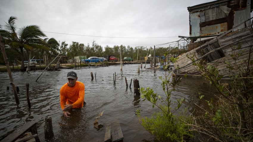 ARTEMISA, CUBA – NOVEMBER 7: A man is seen in the water recovering remains of homes destroyed by Hurricane Rafael at the Artemisa province, 53 kilometers away from Havana, Cuba on November 7, 2024. (Photo by Yander Zamora/Anadolu via Getty Images)