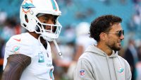 MIAMI GARDENS, FLORIDA – NOVEMBER 24: Tua Tagovailoa #1 of the Miami Dolphins talks with head coach Mike McDaniel prior to an NFL football game against the New England Patriots at Hard Rock Stadium on November 24, 2024 in Miami Gardens, Florida. (Photo by Kevin Sabitus/Getty Images)