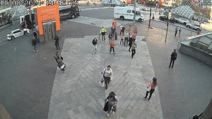 A plank falling to the sidewalk outside Boston's South Station on Friday, Nov. 8, 2024.