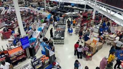 Shoppers line up outside BrandsMart USA in Miami Gardens for Black Friday deals