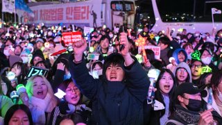 Protesters calling for the ouster of South Korea President Yoon Suk Yeol reacting after the result of the second martial law impeachment vote outside the National Assembly in Seoul on Dec. 14, 2024.