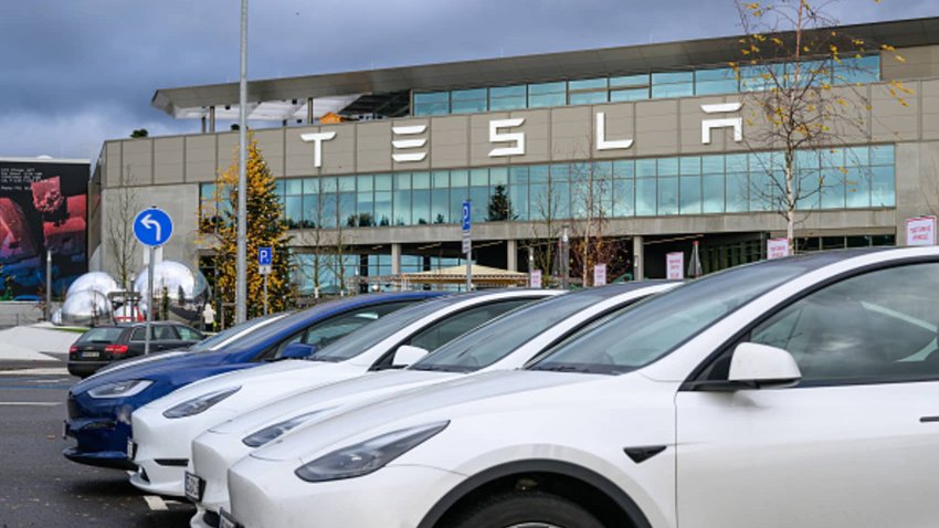 Tesla electric vehicles are parked in a parking lot at the Tesla Gigafactory Berlin-Brandenburg plant. 