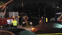 A woman was hospitalized in critical condition after a car crashed into a lake in Hialeah Gardens late Monday night.