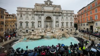 People admire the 18th century Trevi Fountain, one of Rome’s most iconic landmarks, as it reopens to the public after undergoing maintenance, just on time for the start of the Jubilee Year, an event expected to draw millions of visitors to the Eternal City, in Rome, Sunday, Dec. 22, 2024.