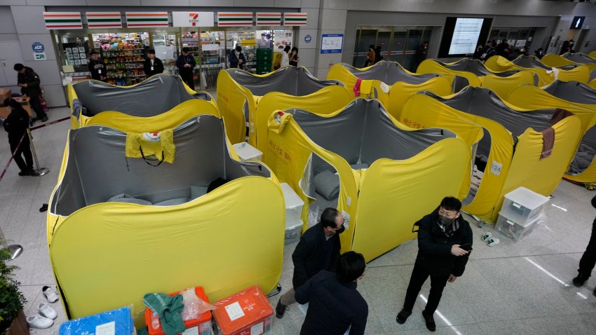 A temporary shelter for relatives of the passengers of a plane which burst into flames, is seen at Muan International Airport in Muan, South Korea, Monday, Dec. 30, 2024.