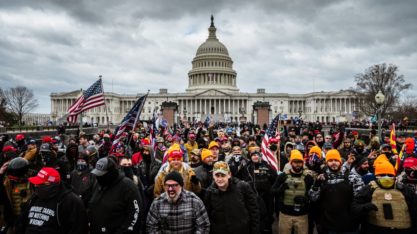 Pro-Trump protesters, including Proud Boys leader Joe Biggs, (plaid shirt at bottom center of frame,) gather in front of the U.S. Capitol Building on January 6, 2021 in Washington, DC. A pro-Trump mob stormed the Capitol, breaking windows and clashing with police officers. Trump supporters gathered in the nation’s capital today to protest the ratification of President-elect Joe Biden’s Electoral College victory over President Trump in the 2020 election. (Photo by Jon Cherry/Getty Images)