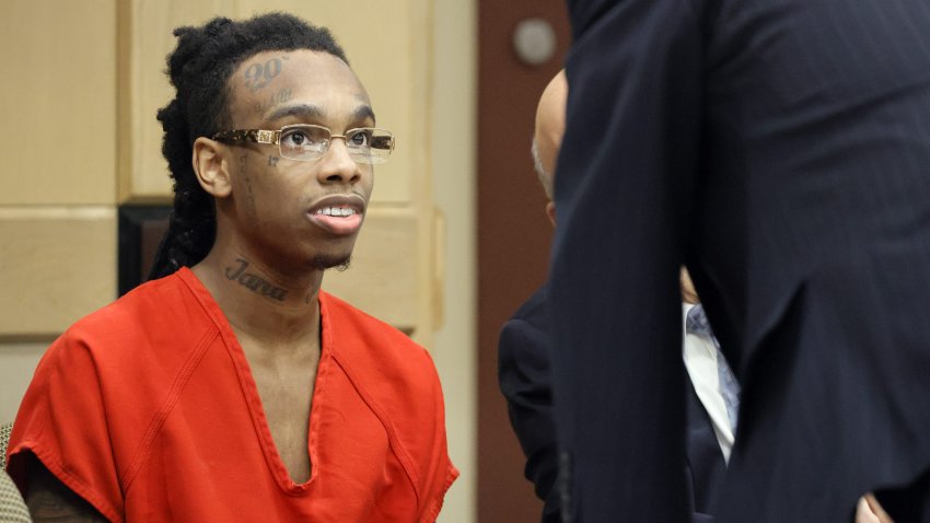 Jamell Demons, better known as rapper YNW Melly, speaks with one of his attorneys during a hearing before his trial at the Broward County Courthouse in Fort Lauderdale, Fla., on Oct. 13, 2023. Demons is accused of killing two fellow rappers and conspiring to make it look like a drive-by shooting in October 2018. (Amy Beth Bennett/South Florida Sun Sentinel/Tribune News Service via Getty Images)