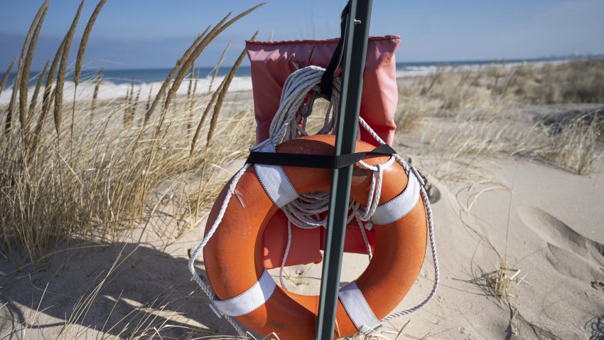 Safety equipment, consisting of a life jacket and a life ring, is placed along Marquette Park Beach in Gary on Tuesday, Feb. 7, 2023. (Kyle Telechan for the Post-Tribune/Tribune News Service via Getty Images)